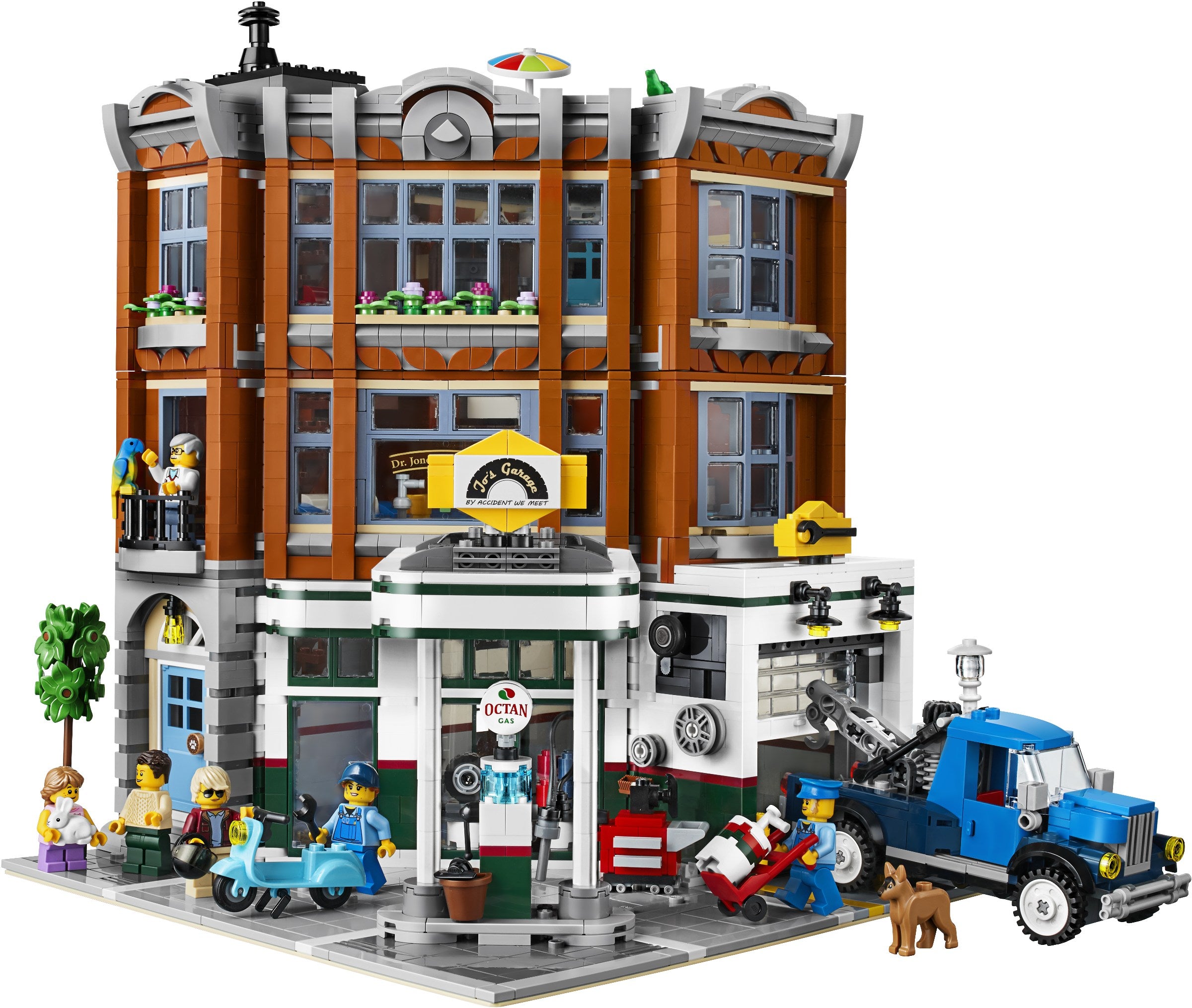 LEGO model of a city street with buildings, vehicles, and people on a white background